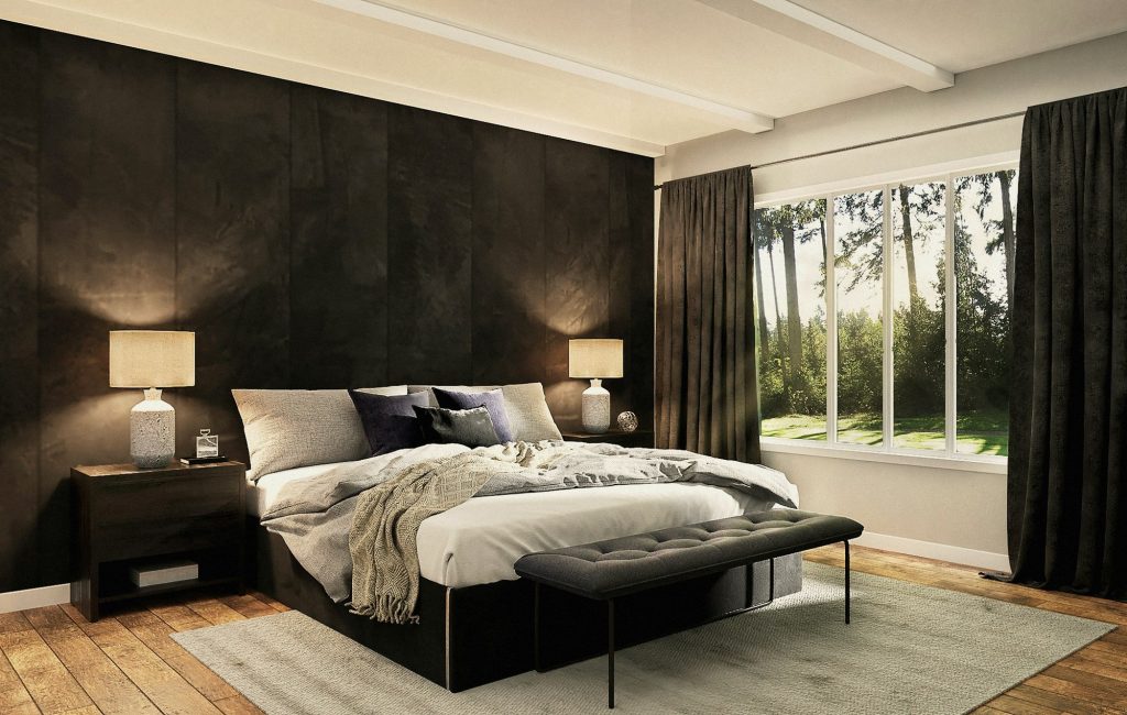 A dark, warm principal bedroom with a low bed, timber wall and garden views.